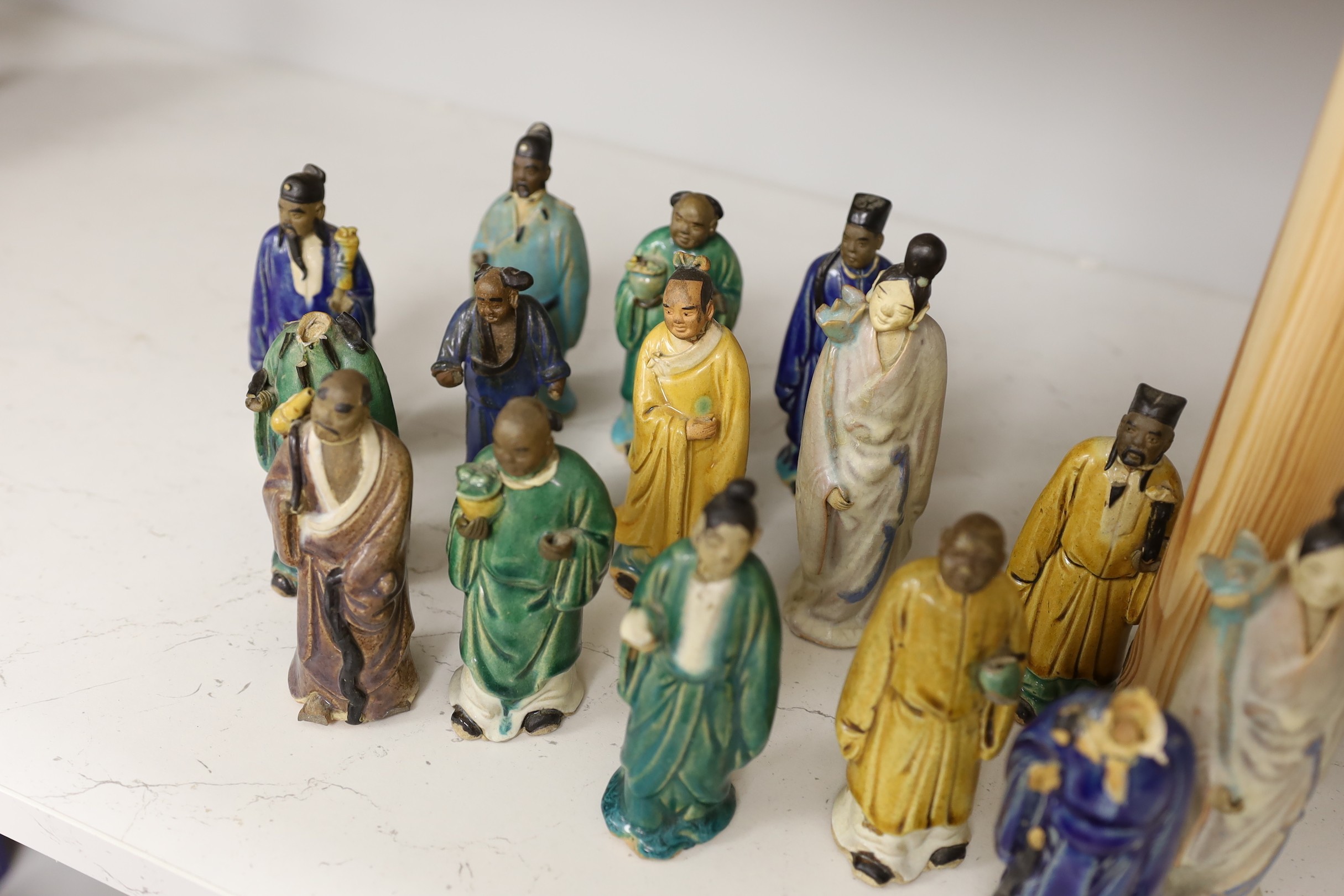 Fifteen Chinese Shiwan type glazed pottery figures, early 20th century, tallest 15cm
